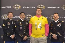 Matt Elam flanked by (from left) Sgt. Brendan McCartney, Sgt. Mike Villarreal, Major Nathan Surrey / Caitlin Healy/U.S. Army All-American Bowl. Photo: USATodayHSS